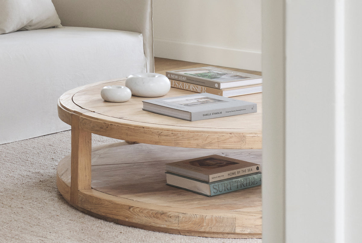 A round coffee table made of old elm timber