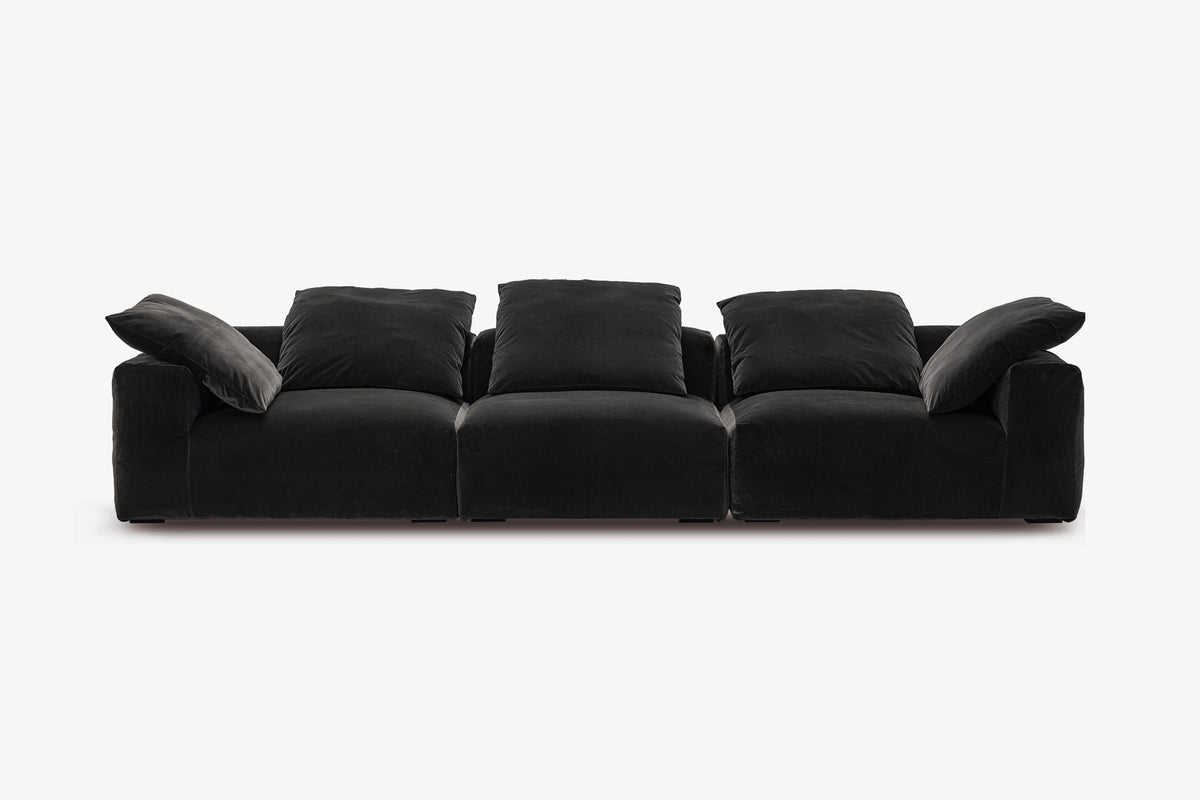 Black velvet sofa, long three-piece configuration, studio front view