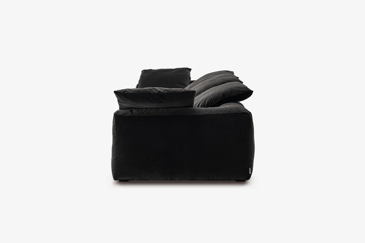 Black velvet sofa module, side profile view