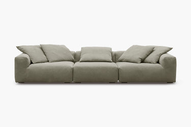 Sage green three-piece sofa with plush pillow back cushions, studio view