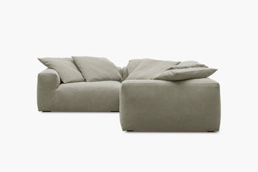 Sage green corner sofa with three modules, three-quarter angled view