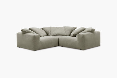 Sage green corner nook sofa with three modules, studio front view