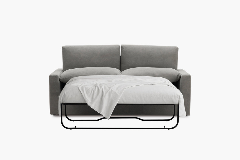 Grey sofa bed shown unfolded from the front with a throw over the mattress.