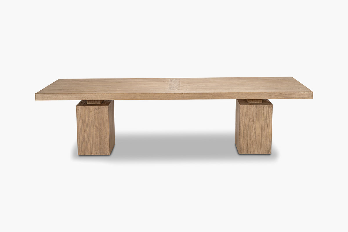 Wooden dining table with square legs on a white background
