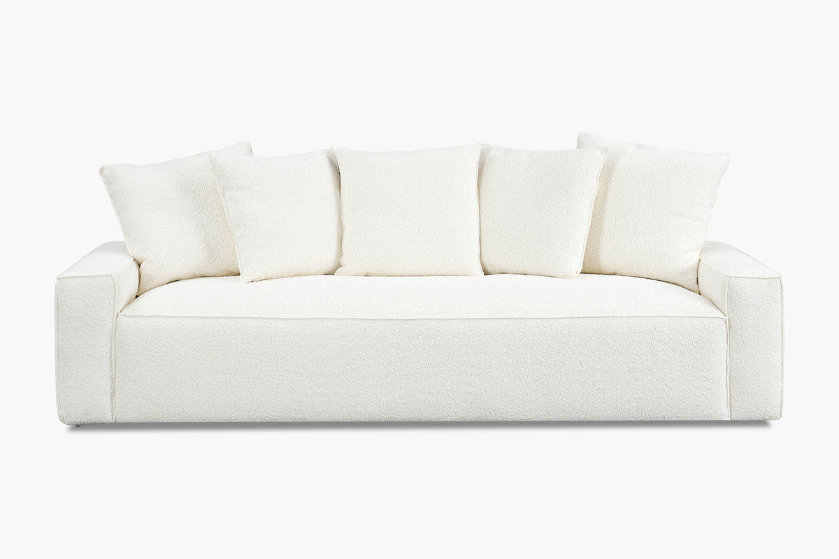 White boucle sofa with five back cushions, studio front view
