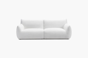 White two-piece modular sofa with rounded arms shown from the front.