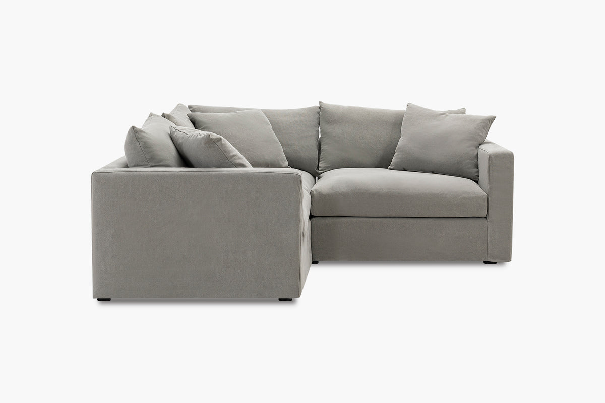 Grey corner sofa, three-piece configuration, studio side view