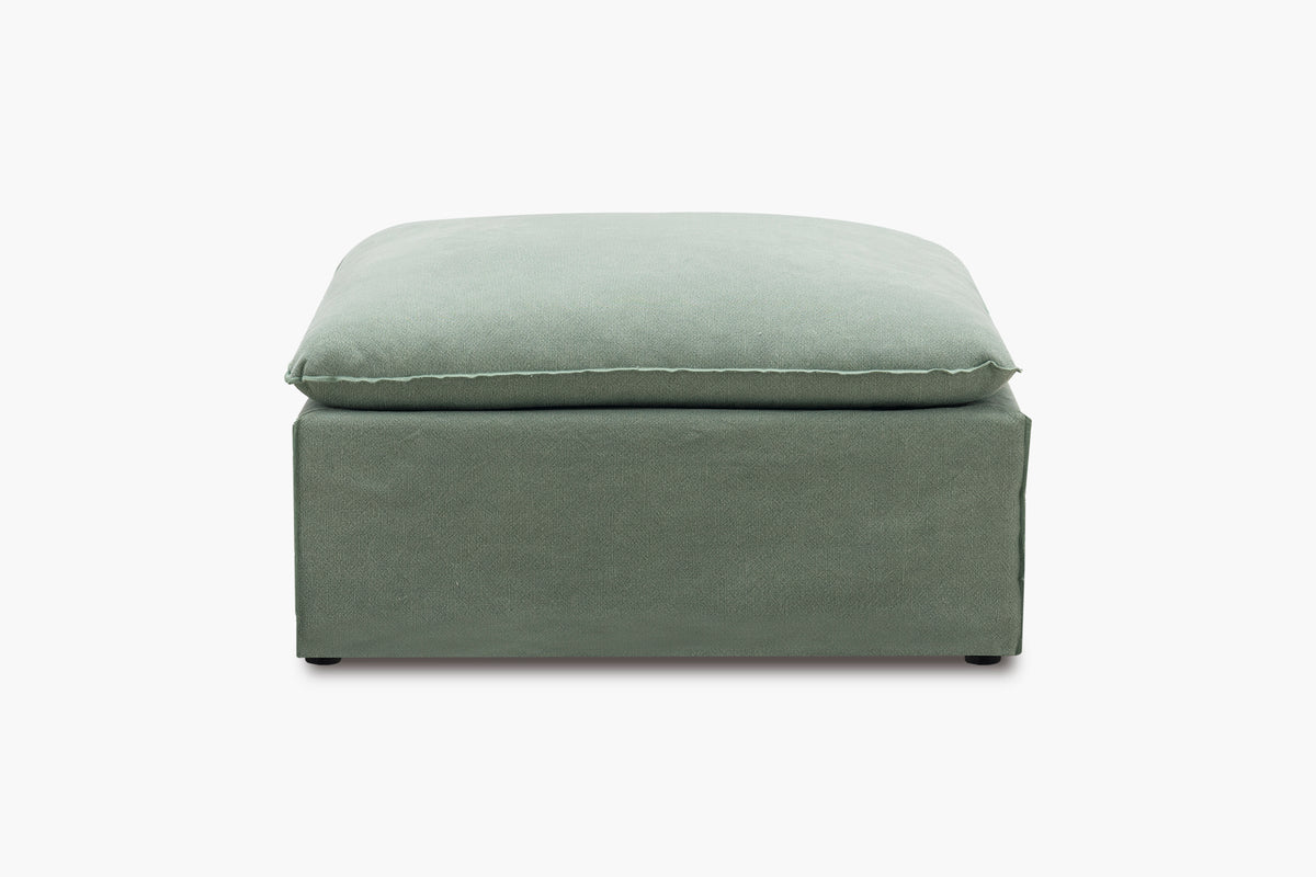 Green ottoman on a white background