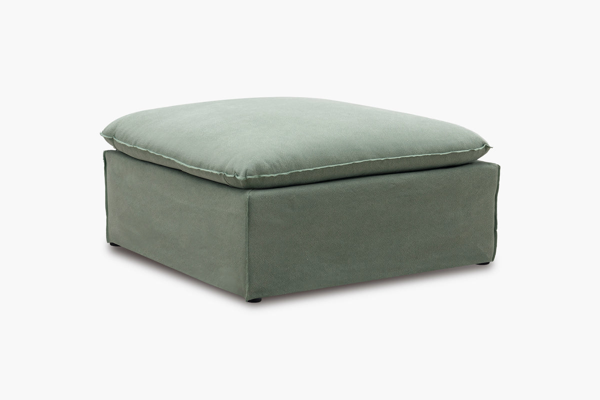 Green ottoman on a white background