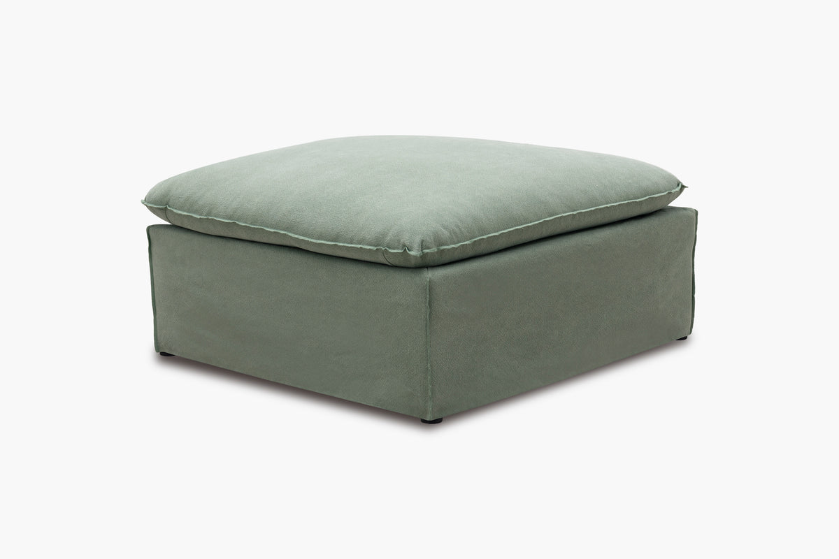 Green ottoman on a white background