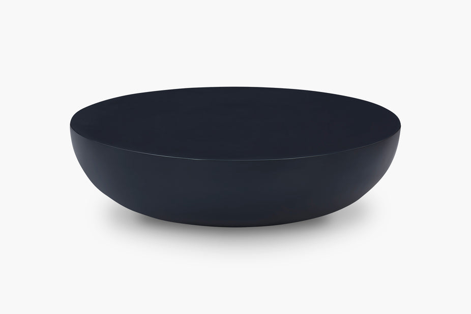 A minimalist, matte-black Coffee Table shown from a side angle against a clean white background.