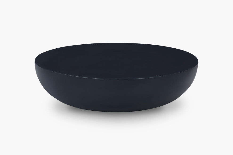A minimalist, matte-black Coffee Table shown from a side angle against a clean white background.