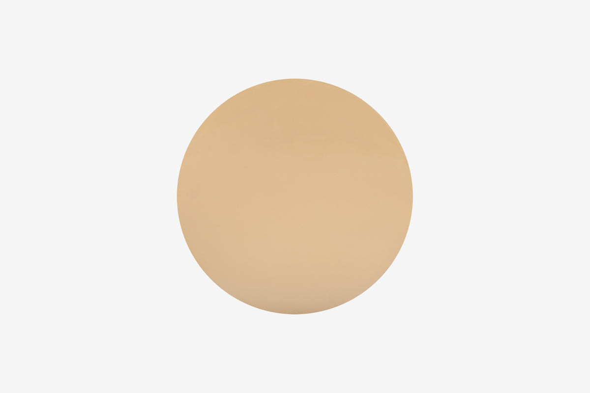Beige cylindrical side table on a white background