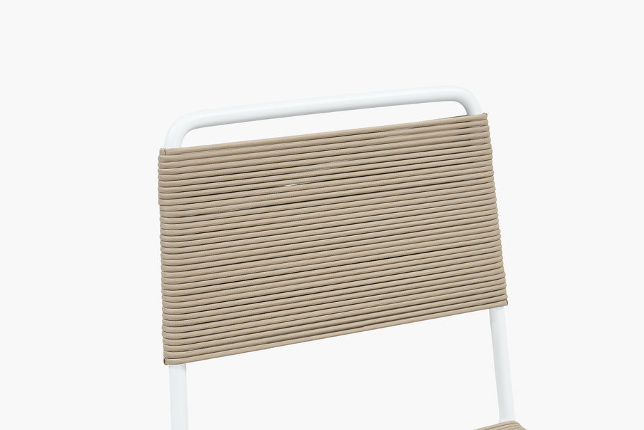 Close-up of tan rope weave on an armless dining chair backrest
