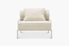 Cream boucle lounge chair with a glossy tan frame, front view
