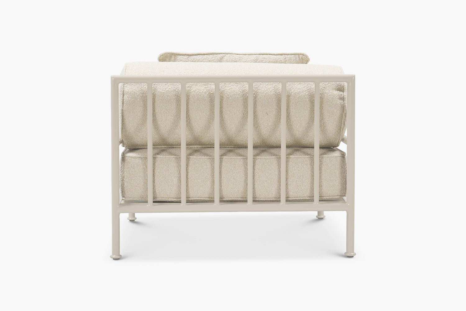 Cream boucle outdoor lounge chair with a glossy tan frame, rear view