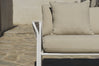 Close-up of white rope armrest and beige boucle cushions on patio