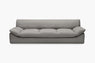 Grey sofa with a deep channeled seat cushion shown from the front.