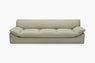 Light taupe sofa with a deep channeled seat cushion shown from the front.