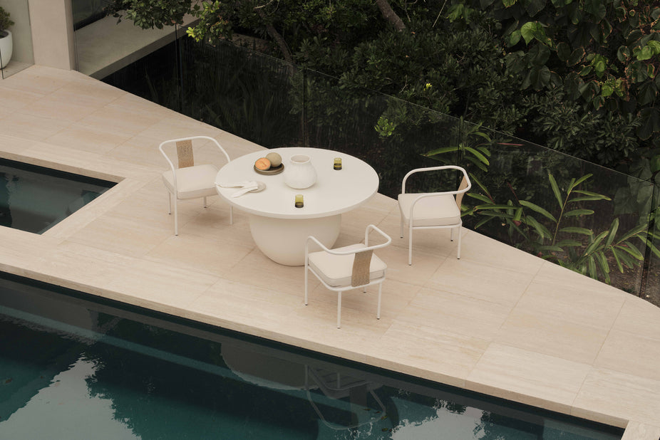 round white dining table with white outdoor dining chairs