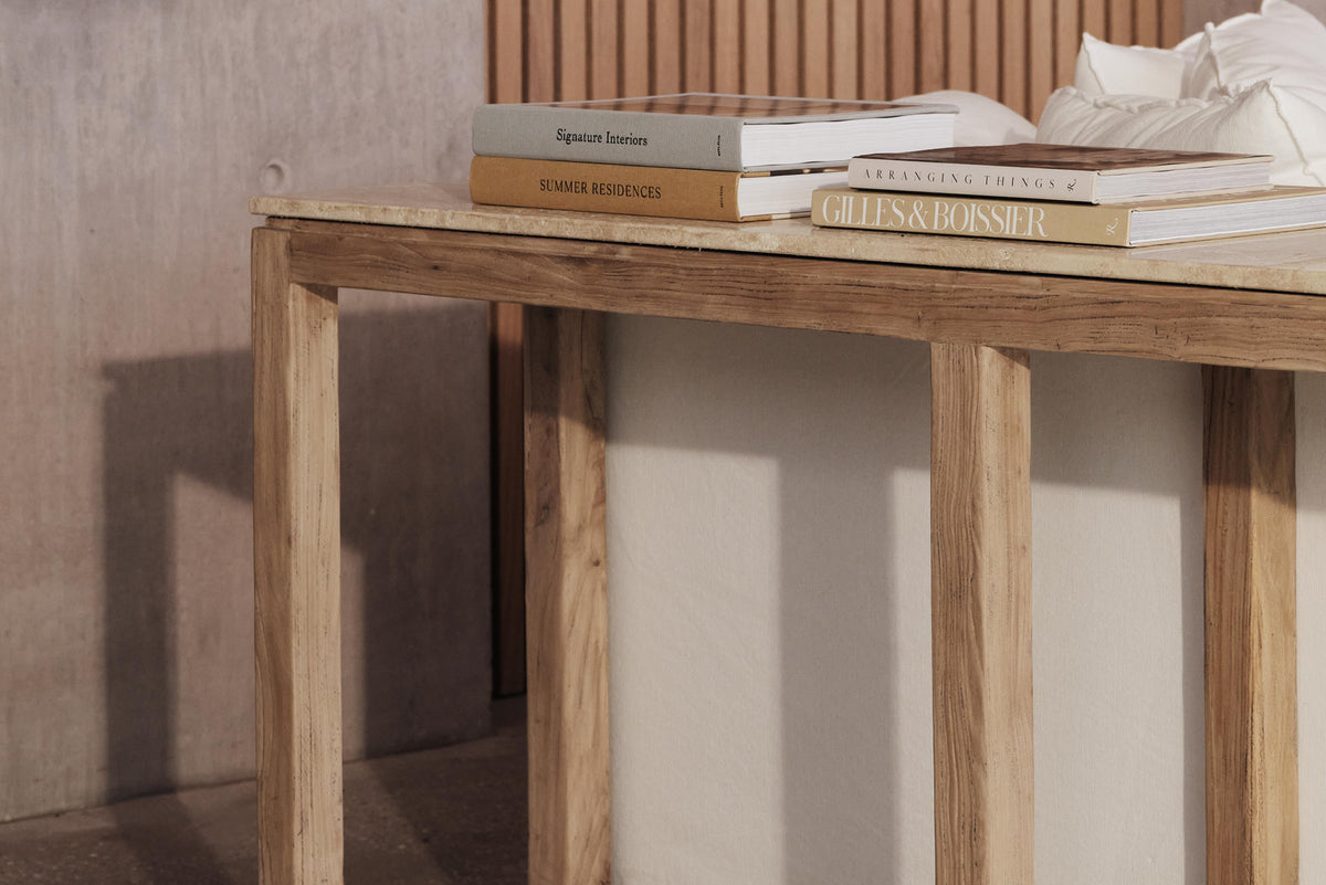 A natural stone and old elm timber console table