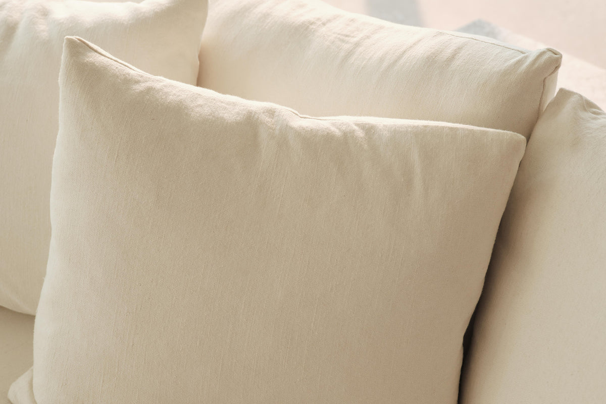 Close-up of cream back cushion on sofa
