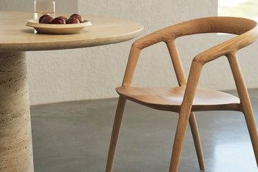 Wooden chair and table in a minimalistic setting