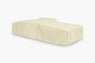 Sand-colored waterproof furniture cover over a reclining sun lounger, angled view
