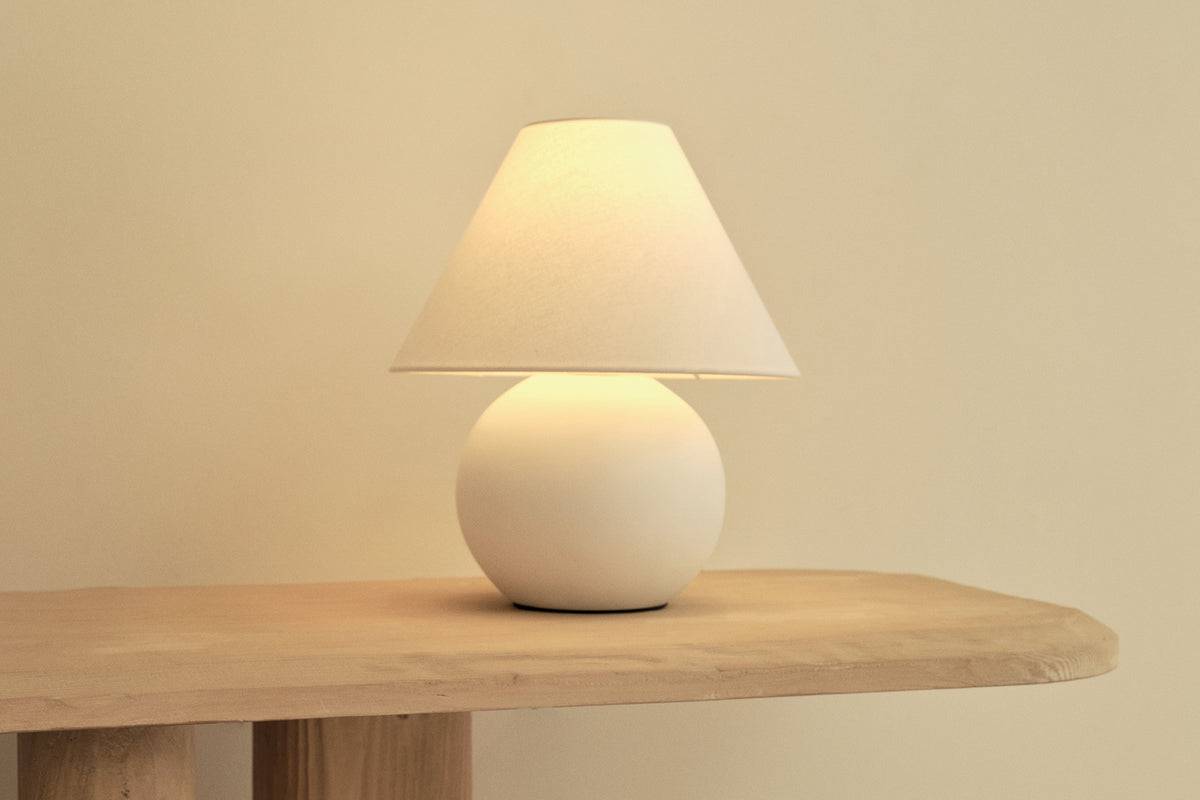 White Cotton Pelleni Table Lamp with a bold resin curved base