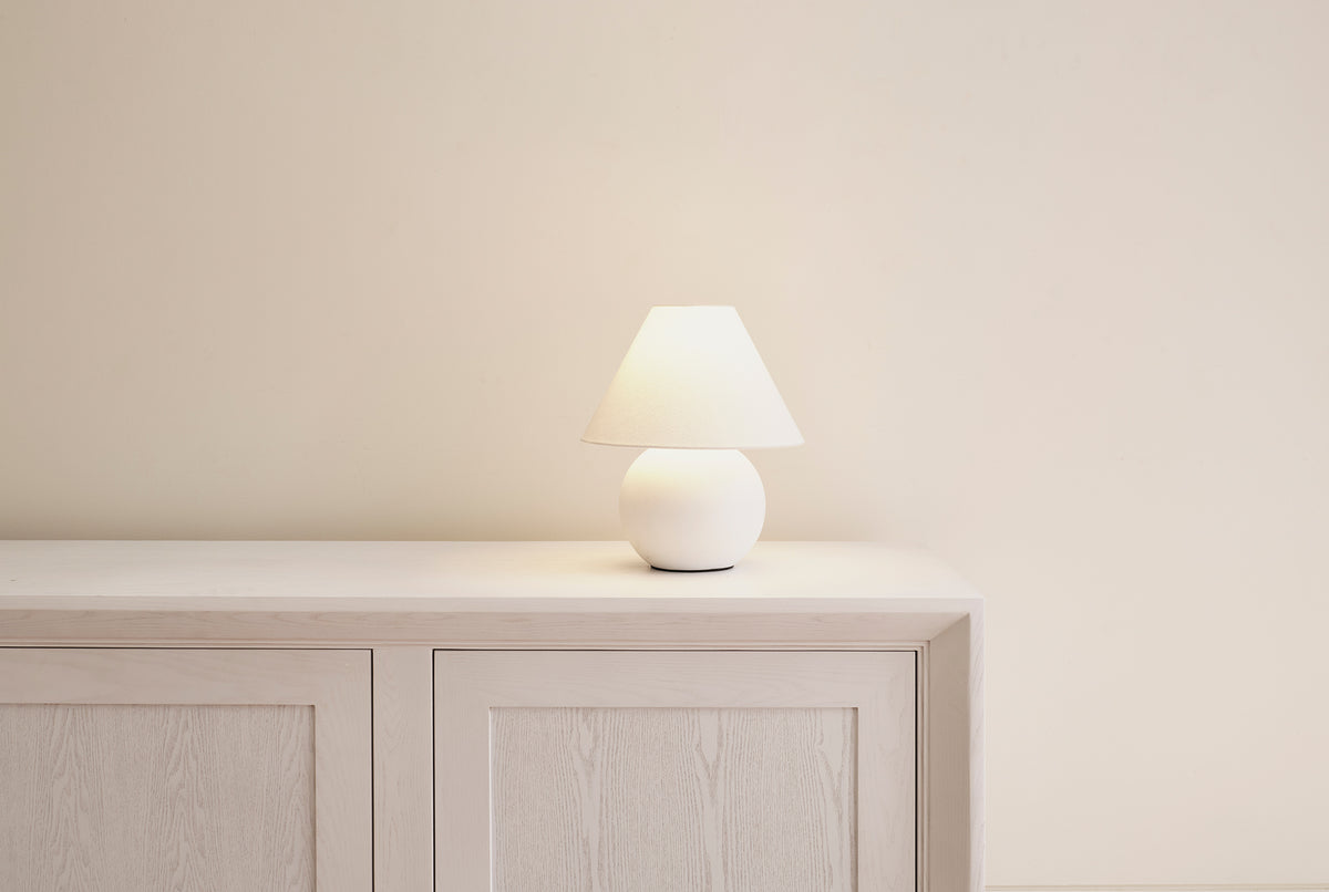 White Cotton Pelleni Table Lamp with a bold resin curved base